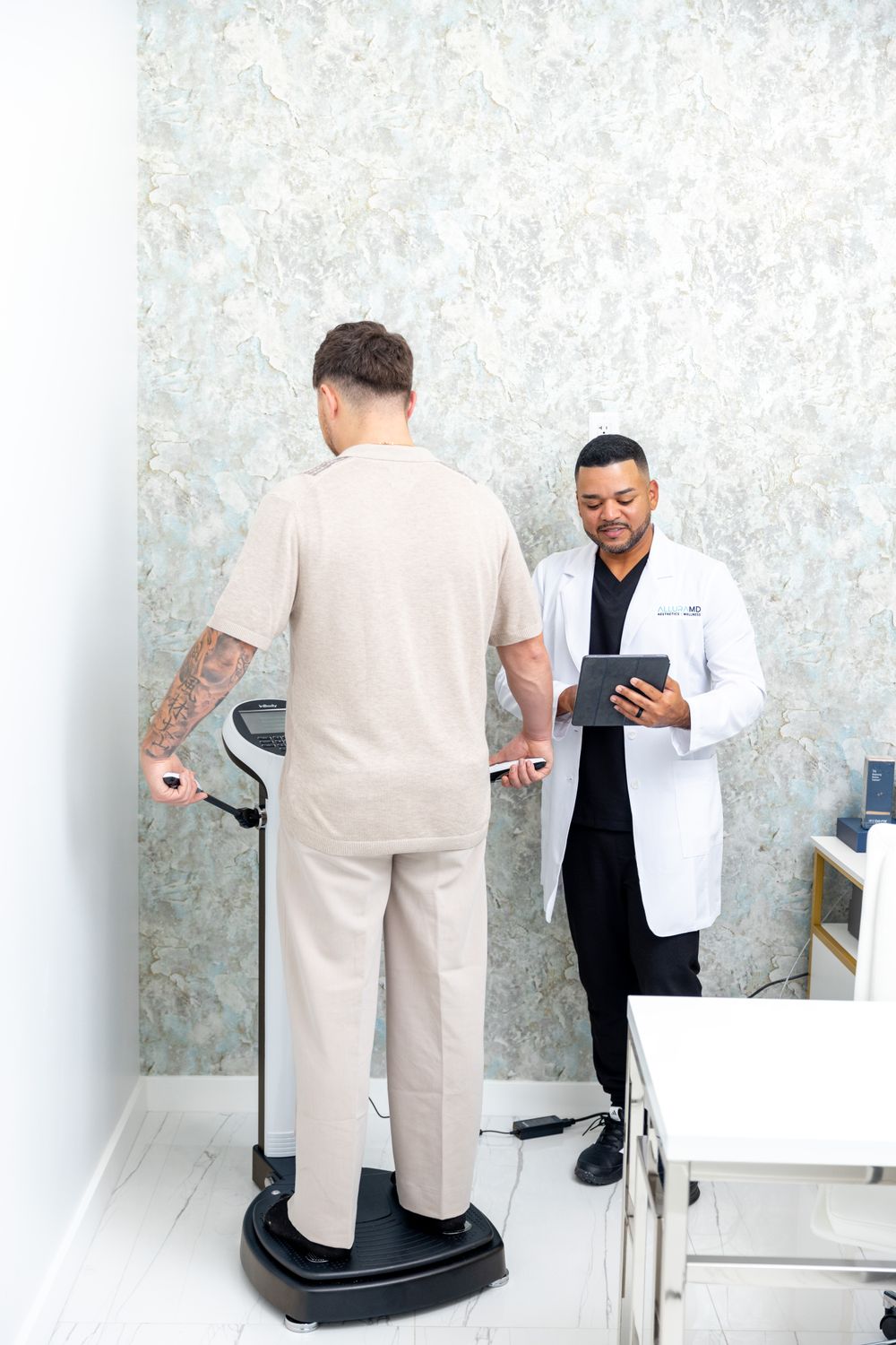 Patient receiving health assessment in medical office.