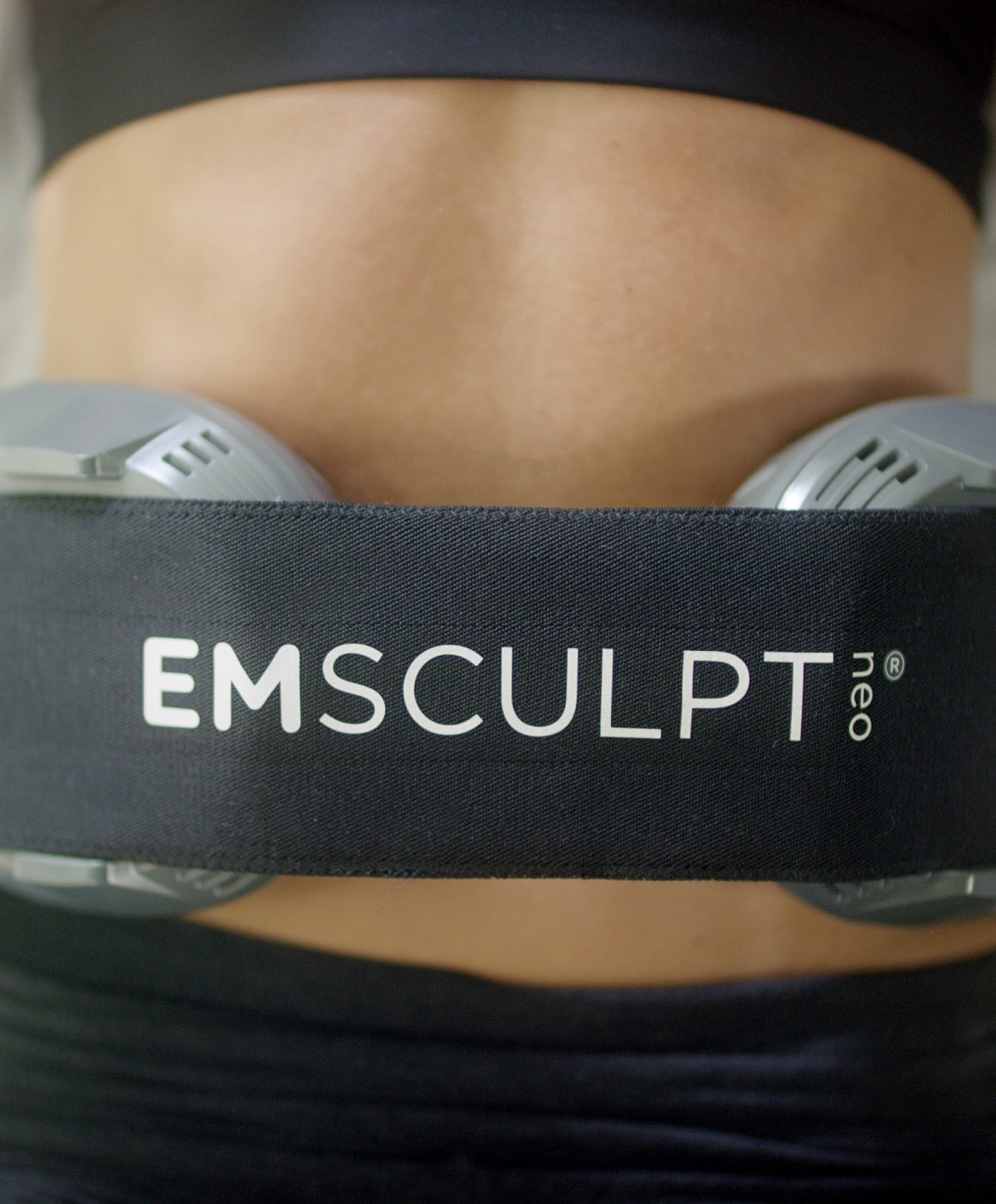 EMSCULPT NEO abdominal treatment device on skin.