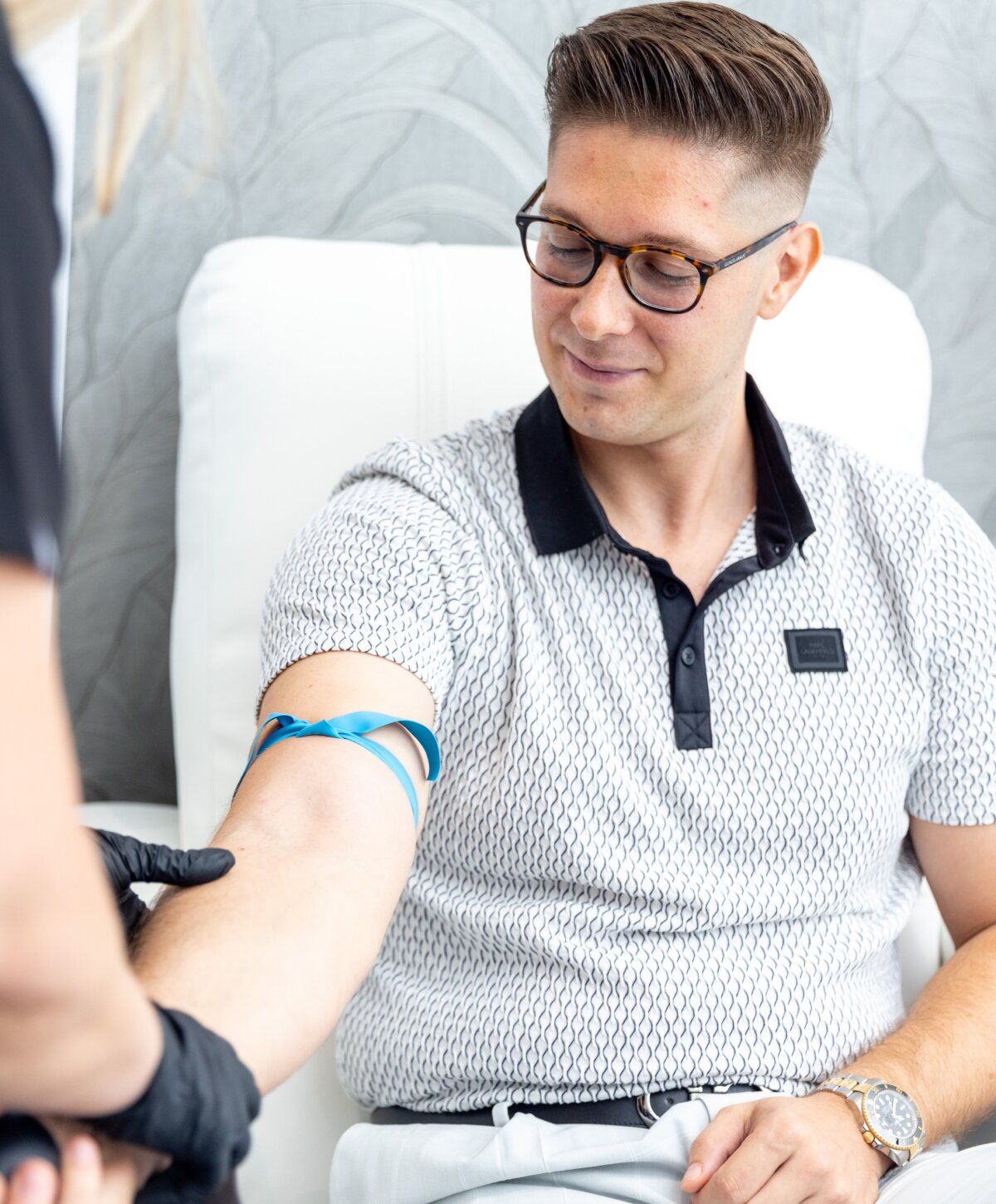 brainstorm iv therapy patient model in a med spa chair preparing for iv