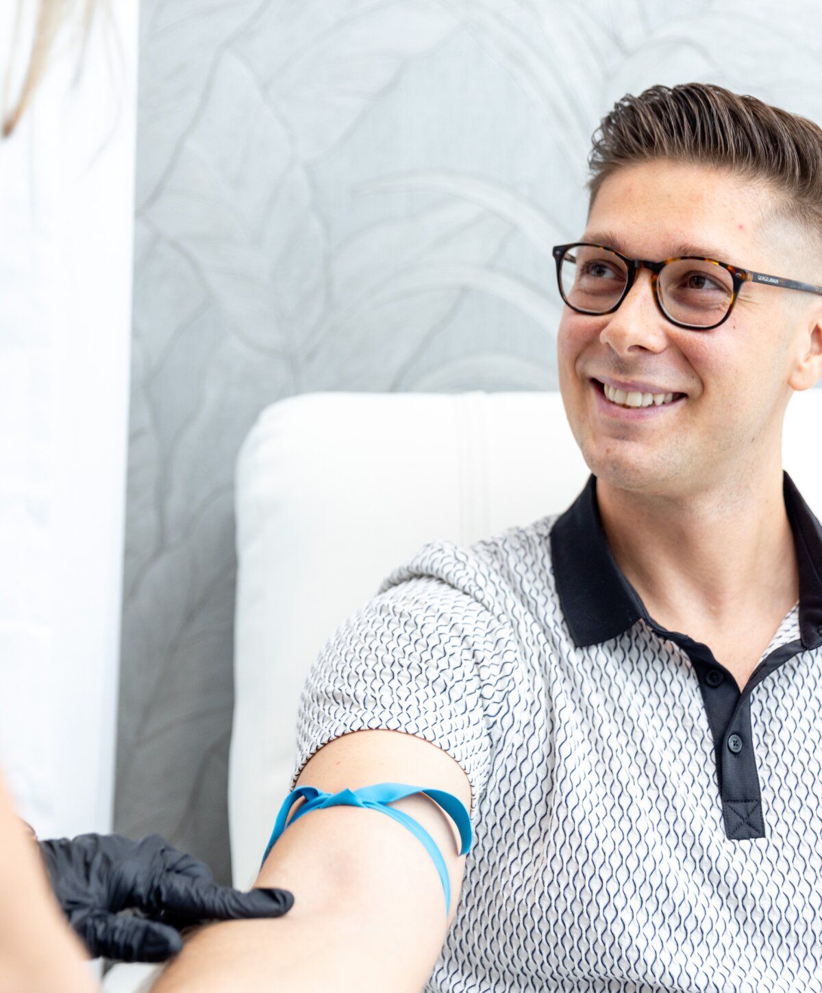 high dose vitamin c iv therapy patient model getting his arm prepped for iv therapy