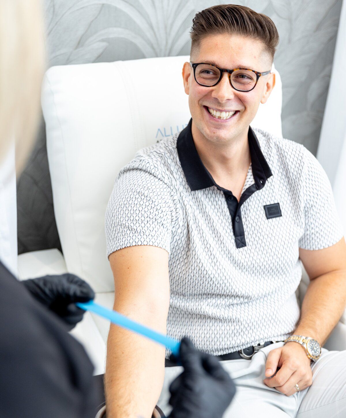 Smiling detox iv therapy patient model being prepared for iv fluid and smiling