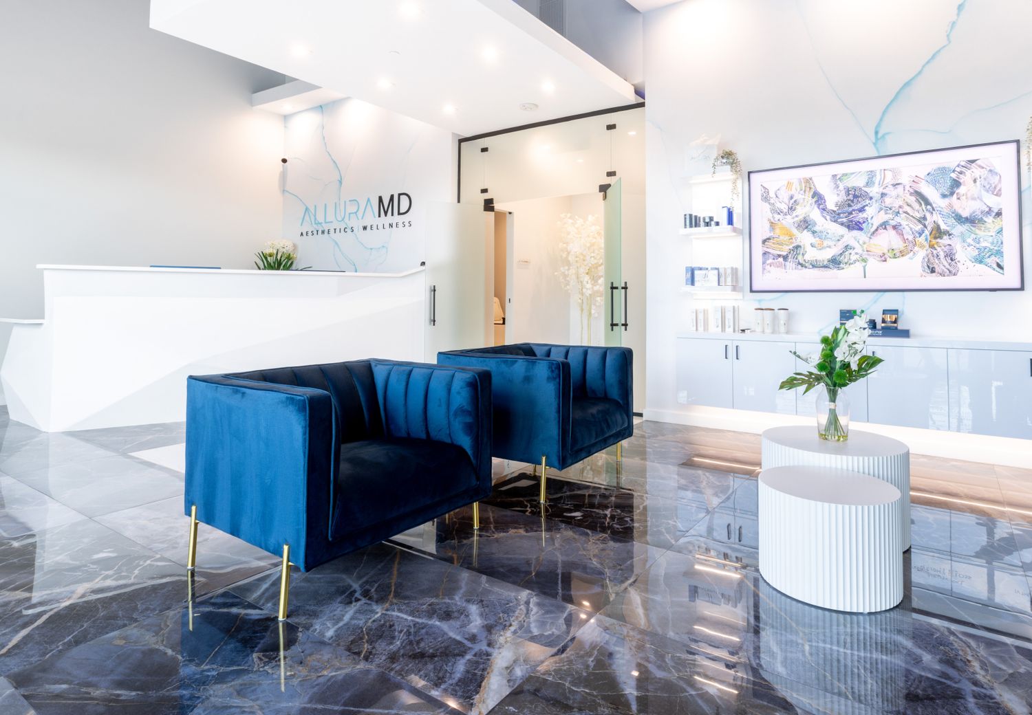 Modern aesthetic wellness clinic interior with seating.