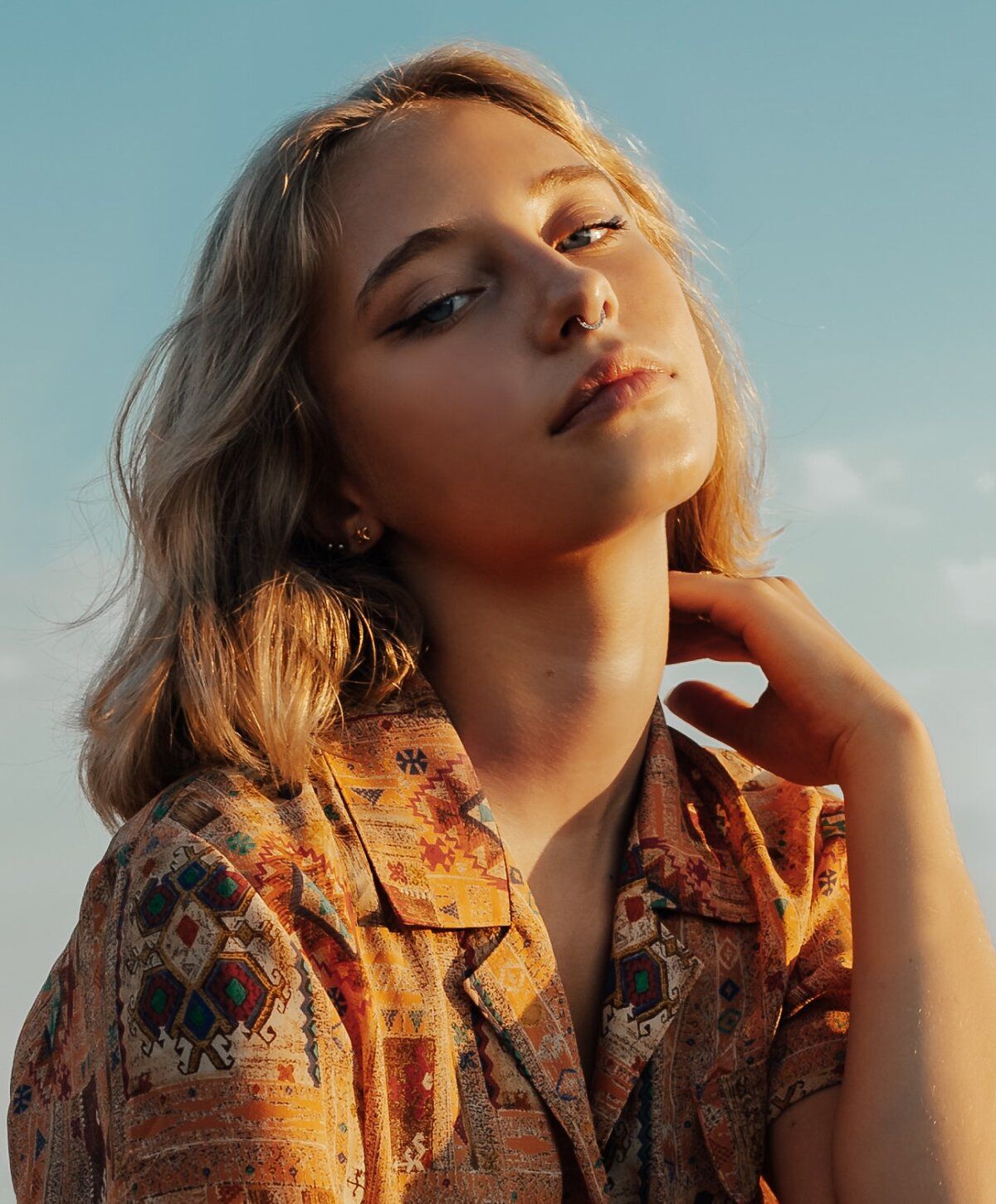 Young prp skin rejuvenation patient model with blonde hair, soft expression.