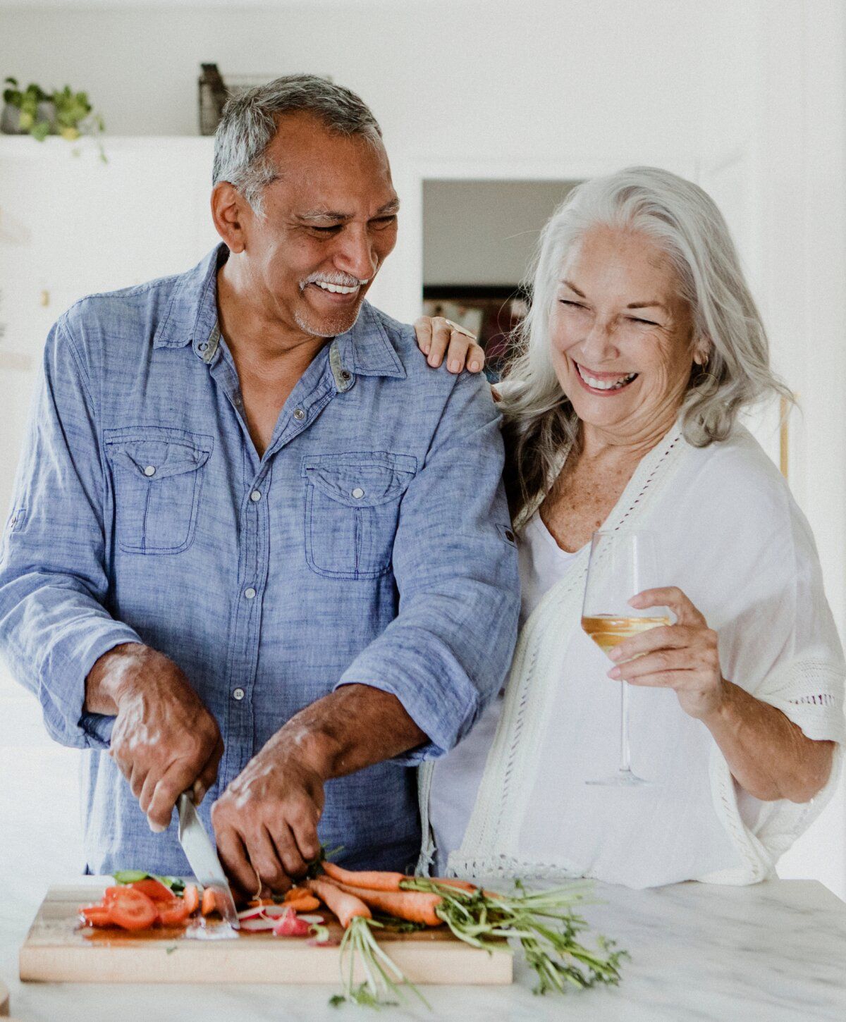 cold and flu iv therapy patient model couple cooking together, enjoying each other's company.