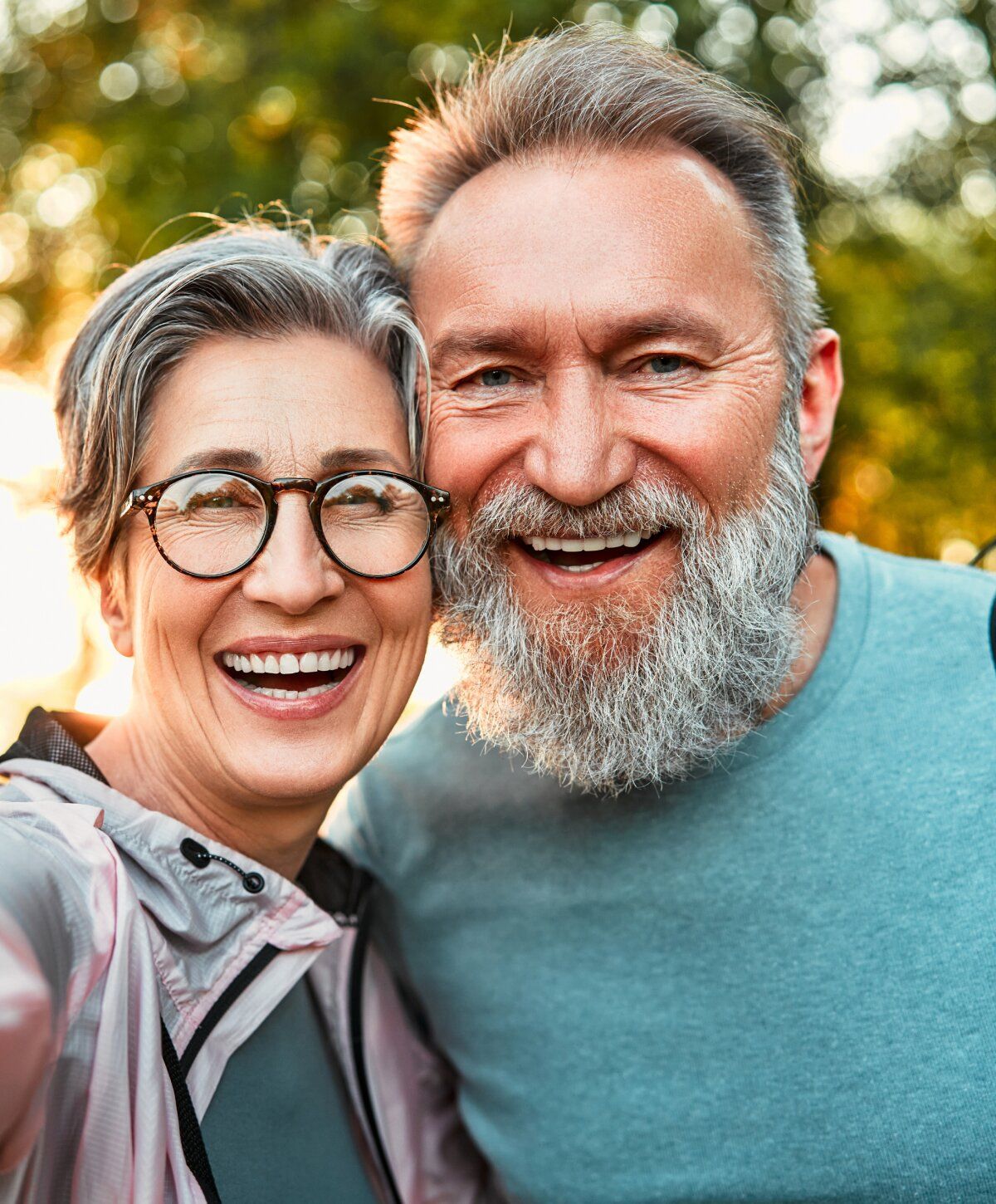 Happy stomach flu iv therapy patient models smiling together outdoors.