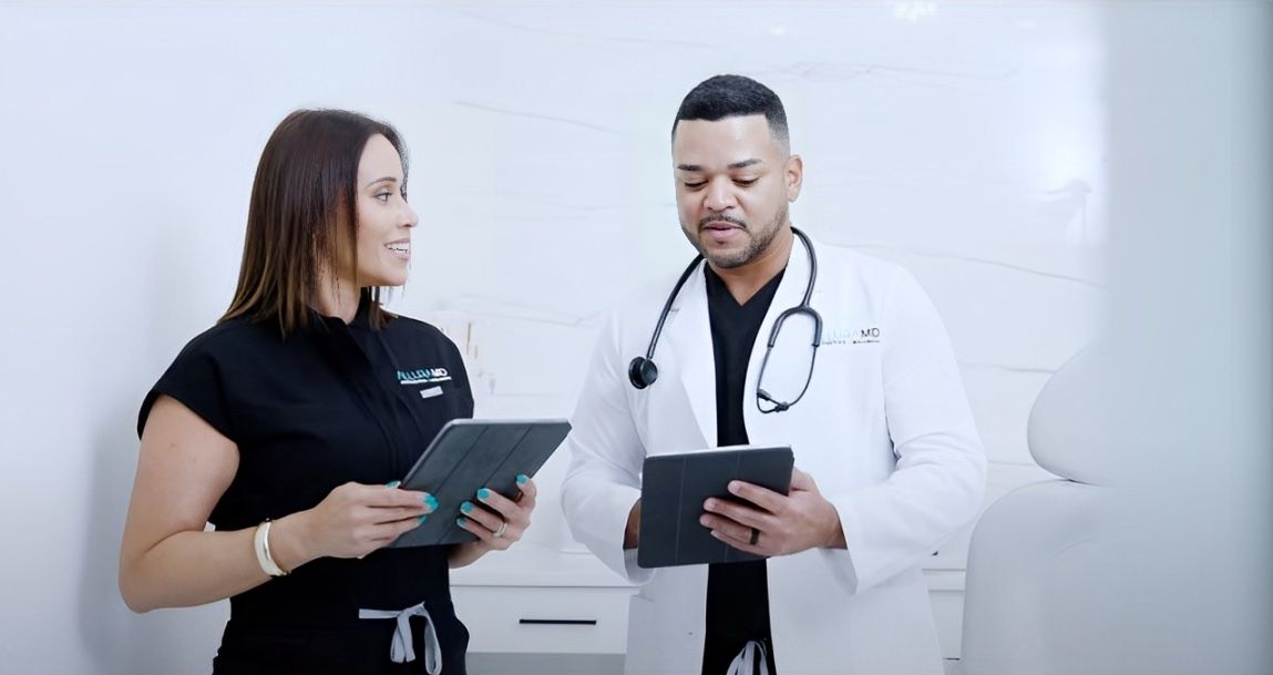 Medical professionals discussing information with tablets