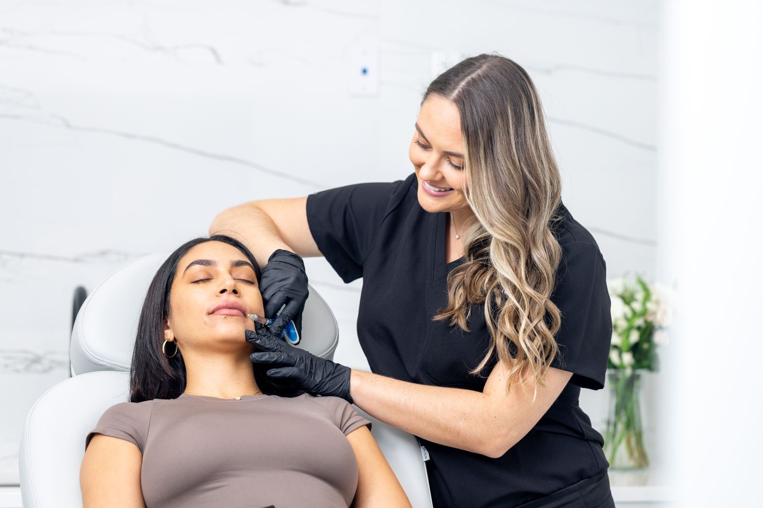 Juvederm patient model receiving an injection in her lip
