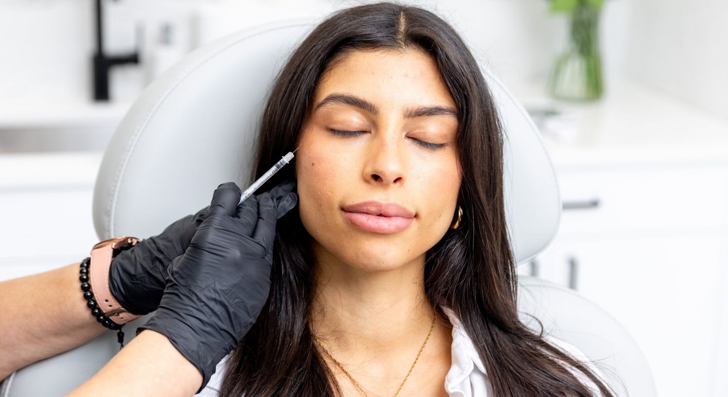 Radiesse patient model receiving an injection in her cheek