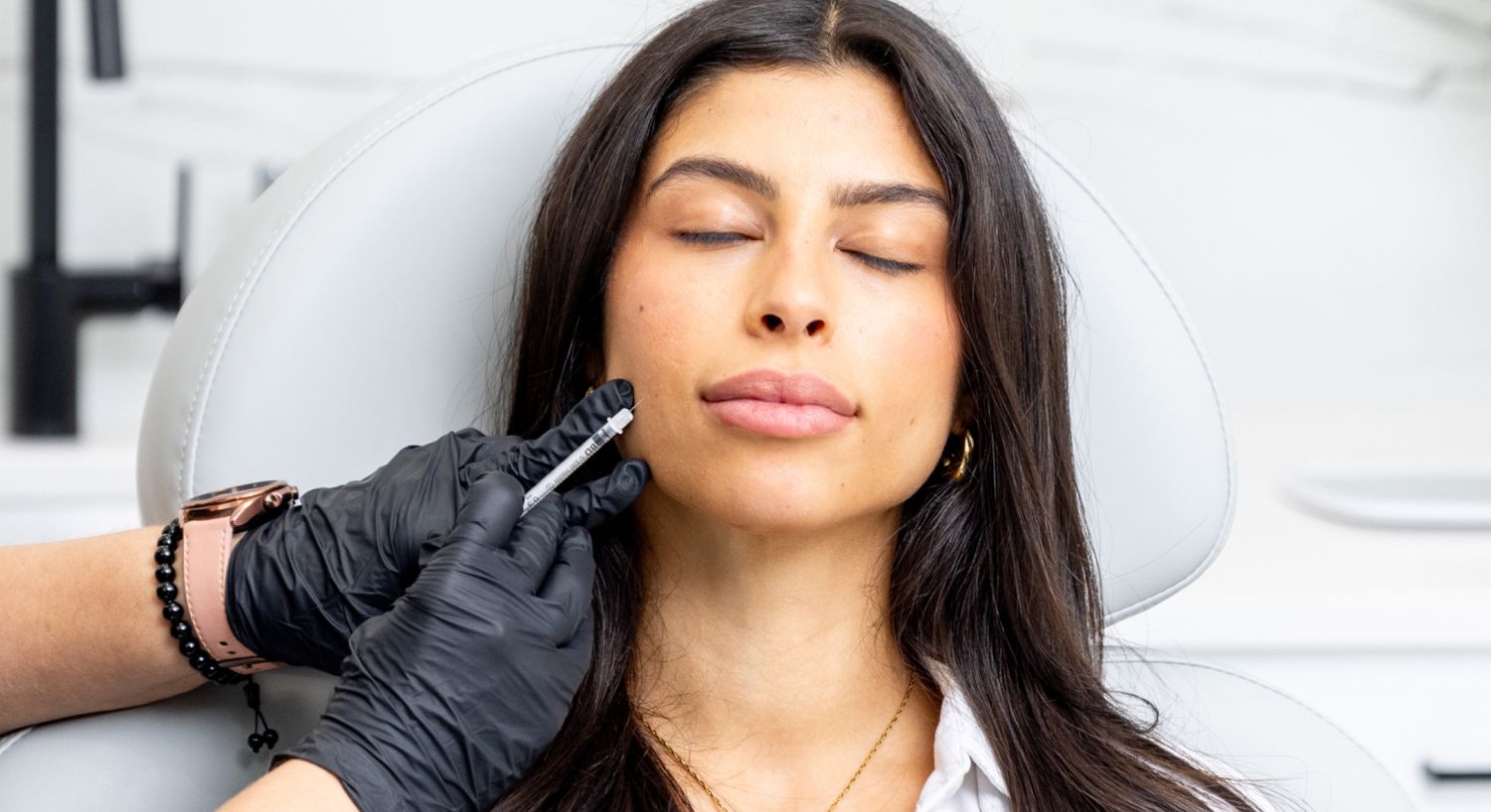 Radiesse patient model receiving treatment at a med spa