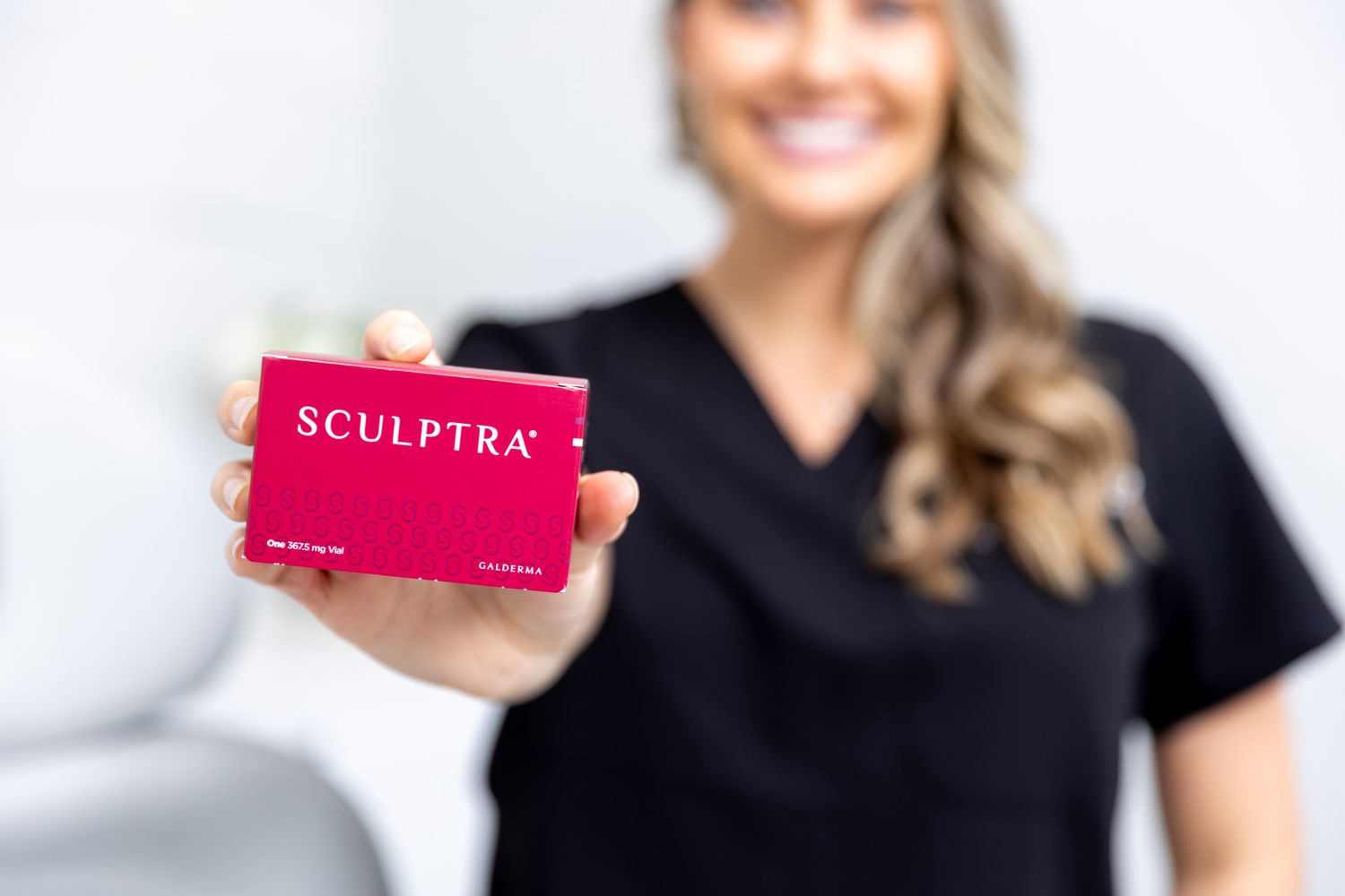 Sculptra pack being held up by med spa staff