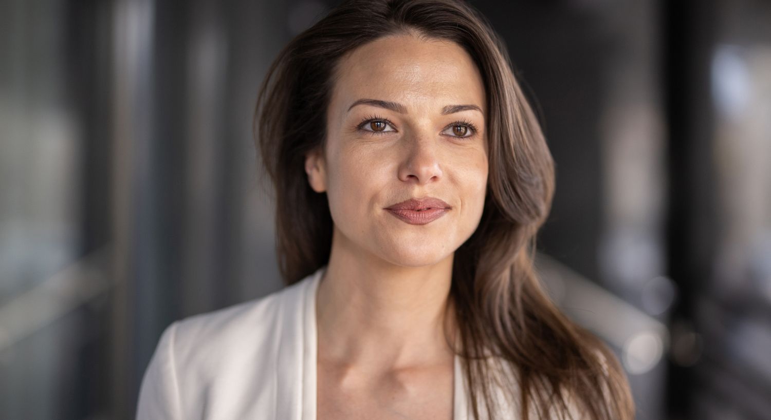 Stomach Flu IV therapy patient model with long brown hair and a white blazer