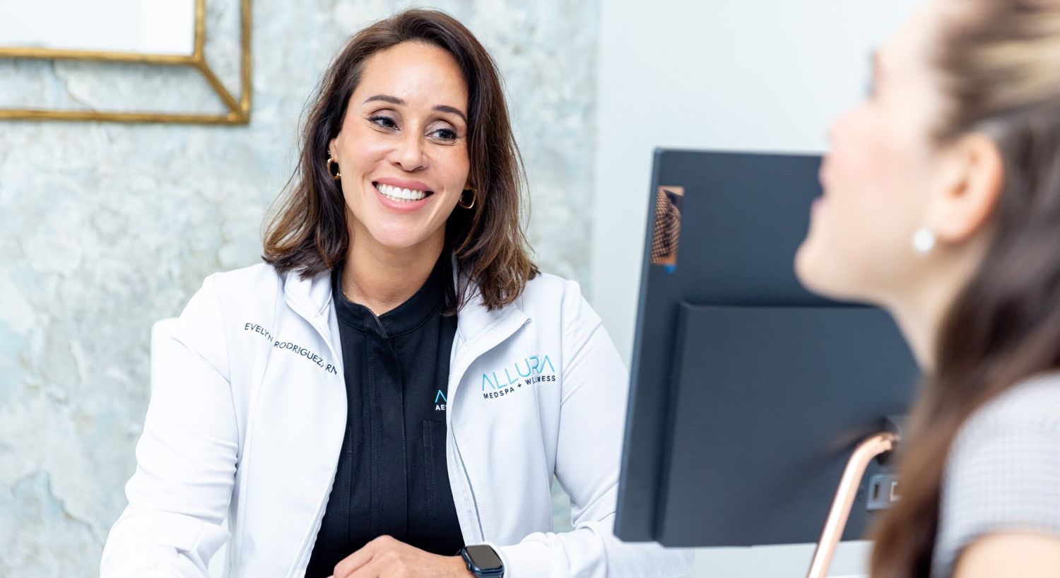 Alleviate iv therapy patient model consulting with med spa staff